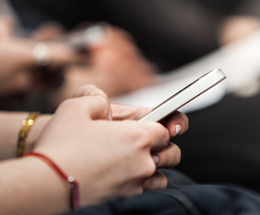 An image of someone using their phone and representing MyAccount