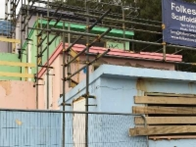 Image of Beach huts prior to renovation - desolate.