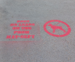 An image showing a dogs on lead stencil