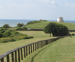 View of East Cliff looking towards the Martello Tower and the sea beyond.