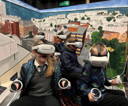 Pupils from a Folkestone primary school wearing virtual reality headsets at a public engagement session.