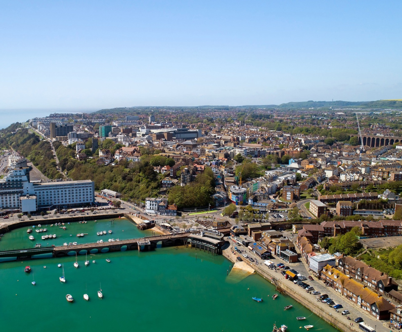 A wide, aerial shot of Folkestone from the Harbour area.