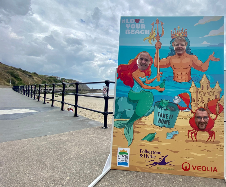 An image of Cllrs J Martin, P Blakemore and Prater in the new face-in-a-hole board at Sunny Sands, Folkestone promoting the summer 'Love Your Beach' campaign which highlights anti-littering and sea safety