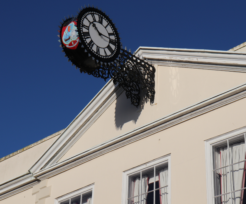 A photograph of the top of Hythe Town Hall in Hythe High Street, with a focus on the building's clock.