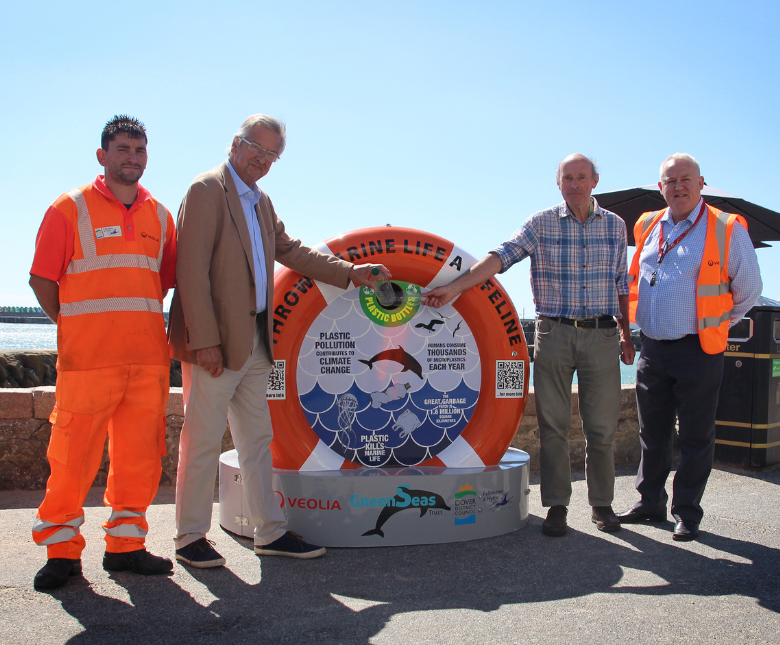 An image of cllrs and waste staff at the new plastic bin at the Folkestone seafront