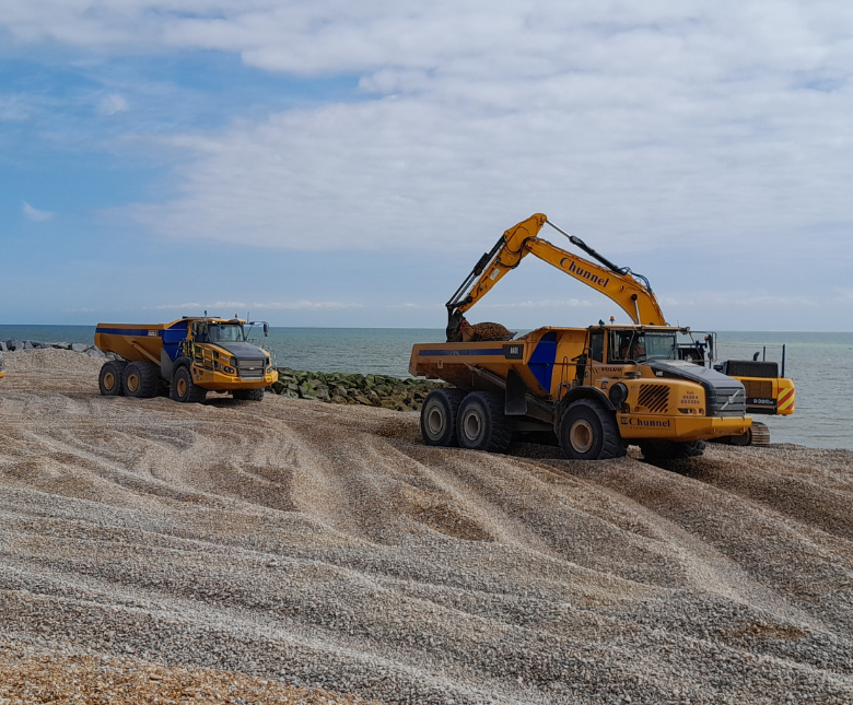 An image of beach management taking place along the coast