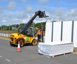 Machine installing now to be removed hoarding around the Princes Parade site.