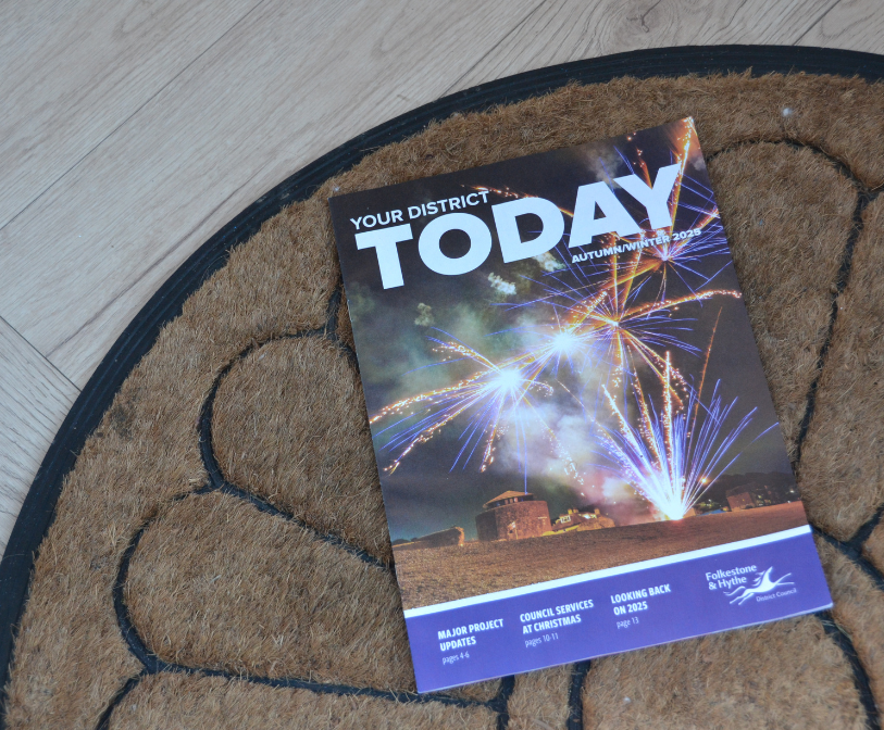 A photograph of Your District Today on a front door mat.