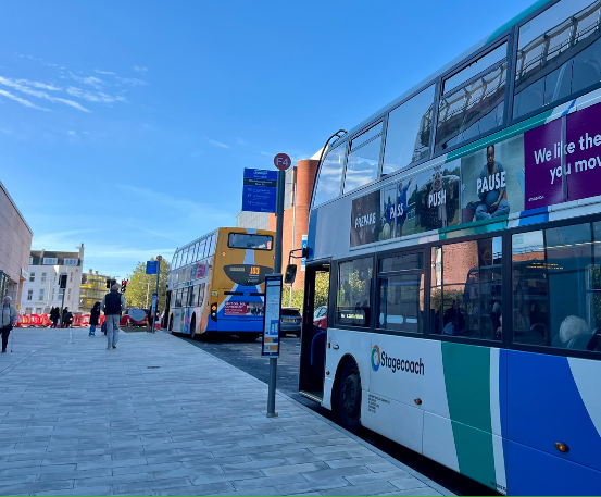Stagecoach buses waiting at two bus stops in Middelburg Square, Folkestone.