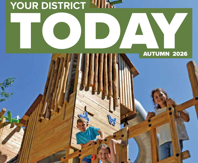 A section of the front cover of the Autumn 2026 edition of Your District Today, with young people playing on play equipment in the Lower Leas Coastal Park on the front cover.