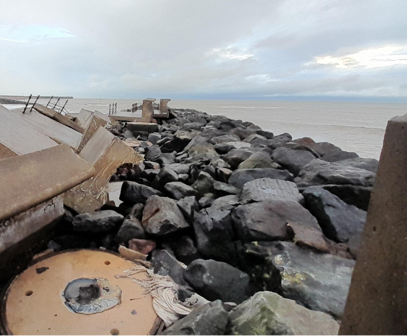 A photograph of the damage caused to the breakwater in Folkestone by Storm Goretti in January 2026.