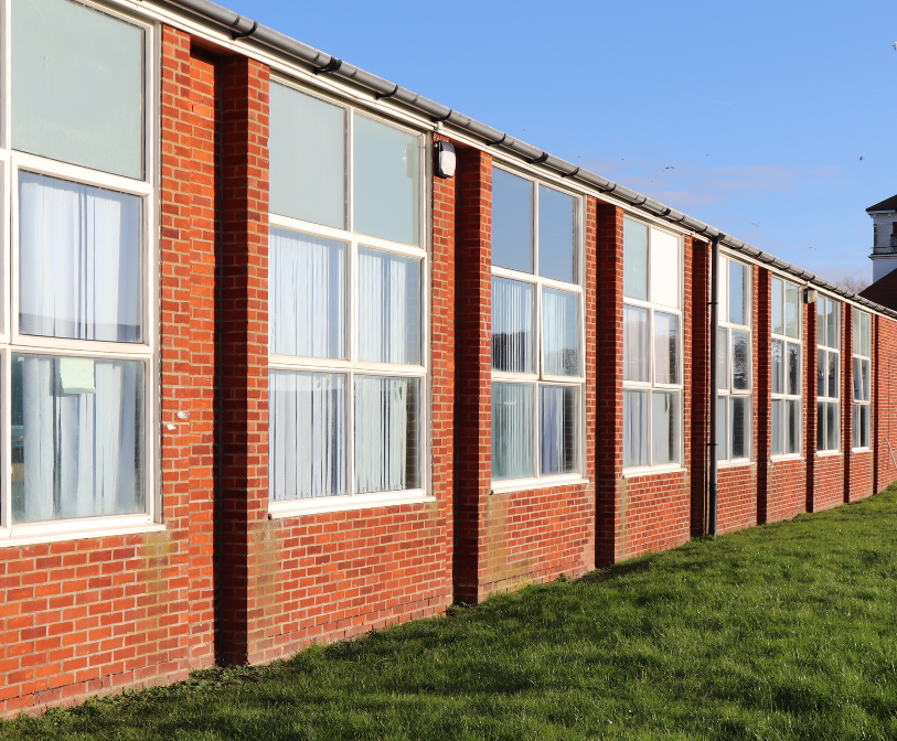 A photograph showing the exterior of the Hythe Swimming Pool building.