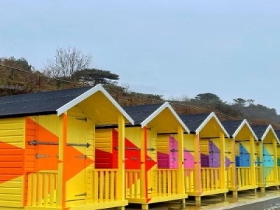 Image of brightly coloured renovated beach huts.